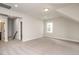 Bonus room with neutral carpet and view into other spaces in the home at 264 Big Bradley Dr, Wendell, NC 27591