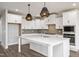 Bright kitchen featuring white cabinetry, a large center island, and modern appliances at 264 Big Bradley Dr, Wendell, NC 27591