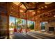 The lakeside pavilion features a wood ceiling, stone fireplace, and outdoor seating at 264 Big Bradley Dr, Wendell, NC 27591