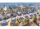 Wide aerial shot presents an organized neighborhood with verdant trees and well-spaced residential properties at 309 Malvern Hill Ln, Morrisville, NC 27560