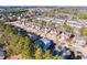Overhead view capturing a residential community with charming homes framed by mature trees at 309 Malvern Hill Ln, Morrisville, NC 27560