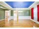 Beautiful dining room offers hardwood floors, trey ceiling with unique blue color, and plenty of natural light at 309 Malvern Hill Ln, Morrisville, NC 27560