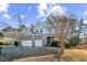 A lovely two-story house with a stone facade, a three-car garage, a manicured lawn, and a traditional style at 309 Malvern Hill Ln, Morrisville, NC 27560