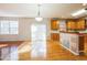 Kitchen with stainless steel appliances, granite countertops, center island, and breakfast area at 309 Malvern Hill Ln, Morrisville, NC 27560