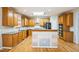 Well-equipped kitchen features stainless steel appliances, granite countertops, and center island at 309 Malvern Hill Ln, Morrisville, NC 27560