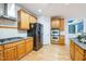 This kitchen features stainless steel appliances, light wood cabinetry, granite countertops, and double wall ovens at 309 Malvern Hill Ln, Morrisville, NC 27560