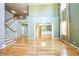 Bright living room showcases hardwood floors, staircase, soaring ceilings, and plenty of natural light at 309 Malvern Hill Ln, Morrisville, NC 27560