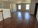 Hardwood flooring and natural light enhance this open living space, with stair access at 309 Malvern Hill Ln, Morrisville, NC 27560