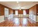 Spacious living room with hardwood floors, stylish wallpaper and molding at 309 Malvern Hill Ln, Morrisville, NC 27560