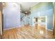 Spacious living room features hardwood floors, high ceilings, staircase, and entry to dining room at 309 Malvern Hill Ln, Morrisville, NC 27560