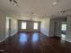Spacious living area featuring hardwood floors, neutral walls, and recessed lighting at 309 Malvern Hill Ln, Morrisville, NC 27560