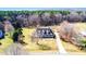 Aerial view of the property, featuring a winding driveway and lush surroundings at 3337 Scarlet Oak Dr, Mebane, NC 27302
