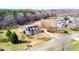 Aerial view of a house with a long driveway and surrounded by lush greenery at 3337 Scarlet Oak Dr, Mebane, NC 27302