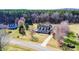 Scenic aerial view of a house with a long driveway and surrounded by lush greenery at 3337 Scarlet Oak Dr, Mebane, NC 27302