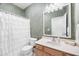 Bathroom with green textured walls, a shower with a white curtain, and a classic vanity at 3337 Scarlet Oak Dr, Mebane, NC 27302