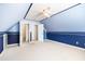 A spacious bedroom features blue walls, neutral carpet, and ample closet space for easy storage at 3337 Scarlet Oak Dr, Mebane, NC 27302