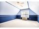 Cozy bedroom with blue walls, white trim, and a window offering natural light at 3337 Scarlet Oak Dr, Mebane, NC 27302