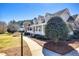 Beautiful home with a covered porch, manicured landscaping, and mature trees at 3337 Scarlet Oak Dr, Mebane, NC 27302
