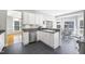 The kitchen features an island, stainless steel appliances, and views to the breakfast nook at 3337 Scarlet Oak Dr, Mebane, NC 27302