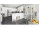 This kitchen offers stainless steel appliances and a bar that overlooks the eat in kitchen at 3337 Scarlet Oak Dr, Mebane, NC 27302