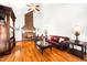 Bright and airy living room with a brick fireplace, hardwood floors, and a ceiling fan at 3337 Scarlet Oak Dr, Mebane, NC 27302