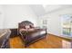 Main bedroom has hardwood floors, a high ceiling, and large windows for natural light at 3337 Scarlet Oak Dr, Mebane, NC 27302