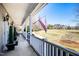 Relaxing covered front porch with comfortable seating and views of the landscaped yard at 3337 Scarlet Oak Dr, Mebane, NC 27302
