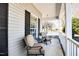Cozy porch seating area offering a relaxing outdoor space with neutral decor at 3337 Scarlet Oak Dr, Mebane, NC 27302