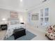 Comfortable bedroom with two windows with plantation shutters and accent rug at 3343 Ridgecrest Ct, Raleigh, NC 27607