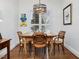 Cozy dining area with natural light, wooden table and chairs, and decorative lighting at 3343 Ridgecrest Ct, Raleigh, NC 27607