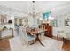 Elegant dining room with vintage furniture, unique wallpaper, and a decorative chandelier at 3343 Ridgecrest Ct, Raleigh, NC 27607