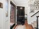 Welcoming entryway featuring a black front door with gold number, hardwood floors, and staircase at 3343 Ridgecrest Ct, Raleigh, NC 27607