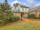 Charming brick home with manicured landscaping and a brick walkway leading to the front door at 3343 Ridgecrest Ct, Raleigh, NC 27607