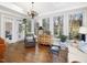 Sunroom featuring large windows with views to outdoors, hardwood floors, and neutral paint at 3343 Ridgecrest Ct, Raleigh, NC 27607