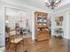 Living room with hardwood floors, china cabinet, and view to the dining room at 3343 Ridgecrest Ct, Raleigh, NC 27607