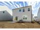 Image of the backyard with small patio and view of the home's exterior at 3505 Triad Ct, Raleigh, NC 27604