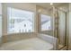 Bathroom featuring a soaking tub and tiled walk-in shower at 3505 Triad Ct, Raleigh, NC 27604