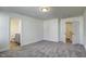 Bright bedroom with neutral walls and access to a walk-in closet and bathroom at 3505 Triad Ct, Raleigh, NC 27604