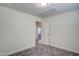 A clean, carpeted bedroom with a door leading to the hallway and natural light at 3505 Triad Ct, Raleigh, NC 27604