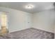 Carpeted bedroom with double door closet, light colored walls, and bright overhead lighting at 3505 Triad Ct, Raleigh, NC 27604