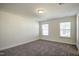 Bedroom with two windows and plush carpeting at 3505 Triad Ct, Raleigh, NC 27604