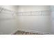 Walk-in closet with vinyl floor, shelving, and ample space for storage at 3505 Triad Ct, Raleigh, NC 27604