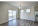 Open dining area with bright lighting, modern flooring, and access to the backyard at 3505 Triad Ct, Raleigh, NC 27604