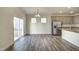Bright dining area featuring an open door to the backyard and modern appliances at 3505 Triad Ct, Raleigh, NC 27604