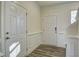 Bright foyer with fresh white trim, and hardwood floors at 3505 Triad Ct, Raleigh, NC 27604