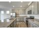 Modern kitchen featuring gray cabinets, stainless steel appliances, and granite countertops at 3505 Triad Ct, Raleigh, NC 27604