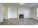 Bright living room with decorative fireplace and durable hardwood floors at 3505 Triad Ct, Raleigh, NC 27604