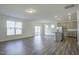 Open-concept living space with stainless steel appliances, a kitchen island, and light gray cabinets at 3505 Triad Ct, Raleigh, NC 27604