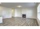 Bright living room featuring a fireplace, modern flooring, and neutral paint at 3505 Triad Ct, Raleigh, NC 27604