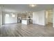 Open floor plan with a combined kitchen and living area with hardwood flooring at 3505 Triad Ct, Raleigh, NC 27604